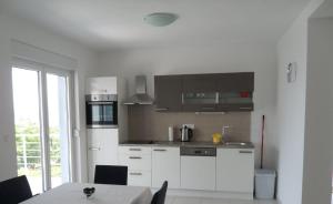 Apartments with a parking space Novi Vinodolski - 12498