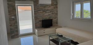 Two-Bedroom Apartment with Terrace and Sea View room in Apartments by the sea Bilo Primosten - 14601