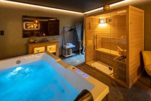 Appartements La Suite - Spa & Sauna : photos des chambres