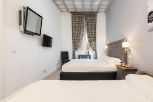 Superior Triple Room-​Via della Frezza room in Spagna Boutique Luxury Suites