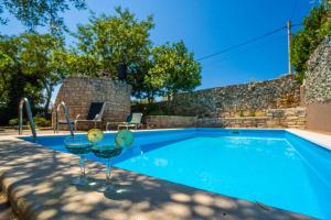 Family friendly apartments with a swimming pool Krnica Marcana 7357