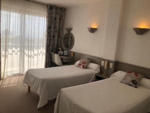 Hotels Plage des Pins : photos des chambres