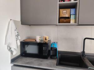 Bilocale in residence vista lago con piscina