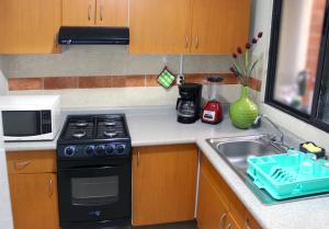 Casa Palmera con Aire acondicionado Alberca Wifi cocina y TV