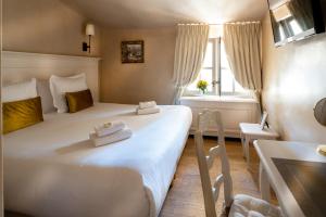 Hotels Les Quatre Dauphins : photos des chambres
