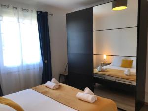 Appartements Un petit bout de reve, balcon, parking & proche centre : photos des chambres