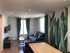 Appartements Un petit bout de reve, balcon, parking & proche centre : photos des chambres