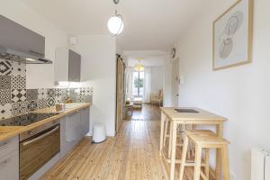 Appartements Le Morphee - Appartement moderne avec jardin : photos des chambres