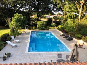 Maisons de vacances Maison de 2 chambres avec piscine privee jardin amenage et wifi a Saint Georges de PointindouxC : photos des chambres