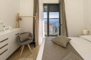 Seaside apartments with a swimming pool Rastici, Ciovo - 17889