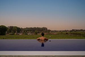 SaffronStays Onellaa, Nashik - infinity pool villa surrounded by a vineyard