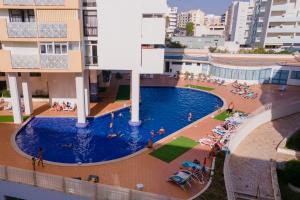 Bright 1BDR Apartment WBalcony & Pool by LovelyStay