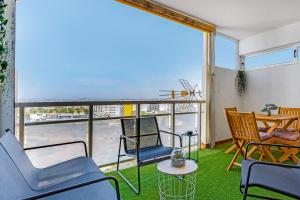Bright 1BDR Apartment WBalcony & Pool by LovelyStay