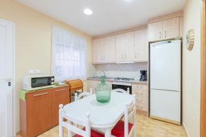 Casita entre naranjas