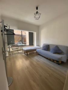 Appartements Coeur de ville au 1er 66M2, vu sur la place : photos des chambres