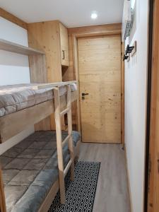 Appartements Courchevel 1550 - SUPERBE appartement SKIS AUX PIEDS ! : photos des chambres