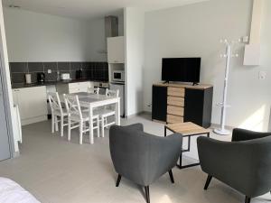 Appartements Studio Soligny : photos des chambres