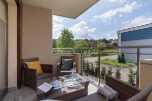 Kraków Błonia Apartment with Balcony by Noclegi Renters