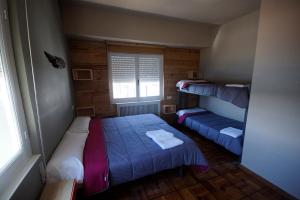 Quadruple Room with Bathroom room in Carving Surf Hostel