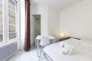 Appartements Place de la Tremoille - petit studio fonctionnel : photos des chambres