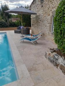 Maisons de vacances La petite maison bleue avec piscine : photos des chambres