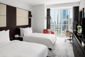 Superior Twin Room with Lake View - Includes daily access to Riva Beach Club with free shuttle service room in Mövenpick Hotel Jumeirah Lakes Towers Dubai