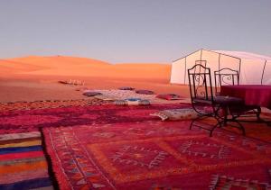 Erg Lihoudi Luxury desert camp with Camel ride, meals & sandboarding