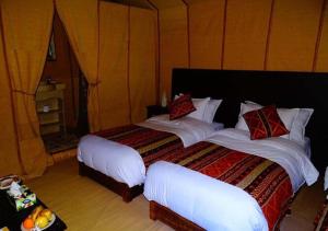 Erg Lihoudi Luxury desert camp with Camel ride, meals & sandboarding