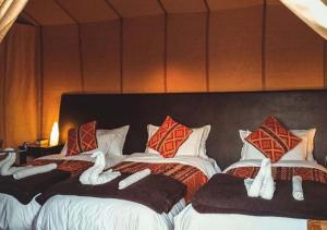 Erg Lihoudi Luxury desert camp with Camel ride, meals & sandboarding