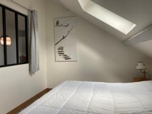 Appartements Les 4 flocons, avec piscine exterieure chauffee a 100m du lac et du centre , wifi, parking, sauna : photos des chambres