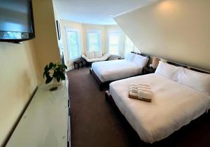 Double Room with Two Double Beds and Fireplace room in Lotus Guest House