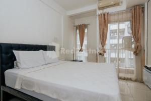 RedLiving Apartemen Skylounge Tamansari - Vanez Room