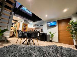 Appartements Capsule Safari - Jacuzzi - Nintendo Switch - Netflix & Home cinema - Pouf geant - Filet suspendu : photos des chambres