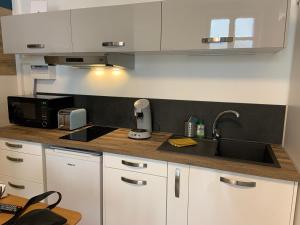 Appartements L'Arlequin- studio tout confort- Coeur de ville : photos des chambres