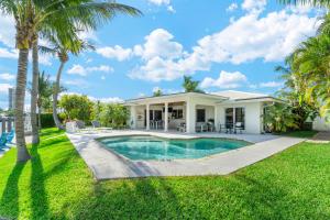 Seven Palms Waterfront- Private Dock, Heated Pool & Lanai -Walk to beach! by Maven Vacation Rentals