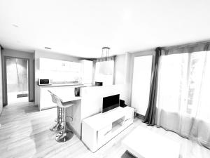 Appartements Le White Cosy a 5 minutes du Lac avec parking privatif gratuit : photos des chambres