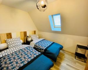 Appartements L'Envolee Alsacienne - Magnifique appartement en duplex : photos des chambres