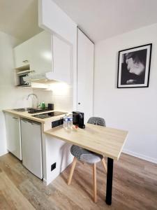 Appartements La Studieuse - Hyper centre ville : photos des chambres