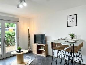 Appartements LE TROPICAL - Terrasse & Parking : photos des chambres