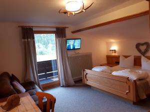 Double Room with Balcony (2 Adults + 1 Child) room in Alpenlandhaus