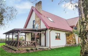 Three-Bedroom Holiday Home  room in Holiday Home Jedwabno with Fireplace I