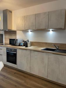 Appartements L’Oradou - Neuf - Tout equipe - Parking - Wifi : photos des chambres