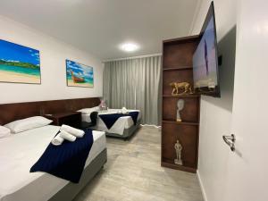 FABULOSO FLAT 225, 2 PISCINAS climatizadas, internet particular 500m Bertioga, Riviera de São Lourenço Flat Duplex inteiro, Adega, cozinha equipada completa serviço de hotelaria, serviço de praia nos finais de semana