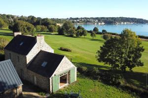 Stone house with view on the sea and the golf