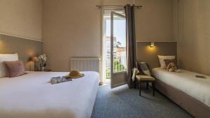 Hotels CERISE Royan - Le Grand Hotel de la Plage : photos des chambres