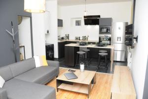 Appartements Grand Appartement Confort : photos des chambres