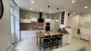 Appartements Au jardin de la Basilique : photos des chambres