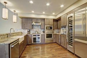 Expansive 4 Bedroom Ski In, Ski Out One Ski Hill Residence Located At The Base Of Peak 8 With Beautiful Views