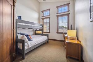 Expansive 4 Bedroom Ski In, Ski Out One Ski Hill Residence Located At The Base Of Peak 8 With Beautiful Views