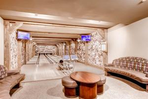 Expansive 4 Bedroom Ski In, Ski Out One Ski Hill Residence Located At The Base Of Peak 8 With Beautiful Views